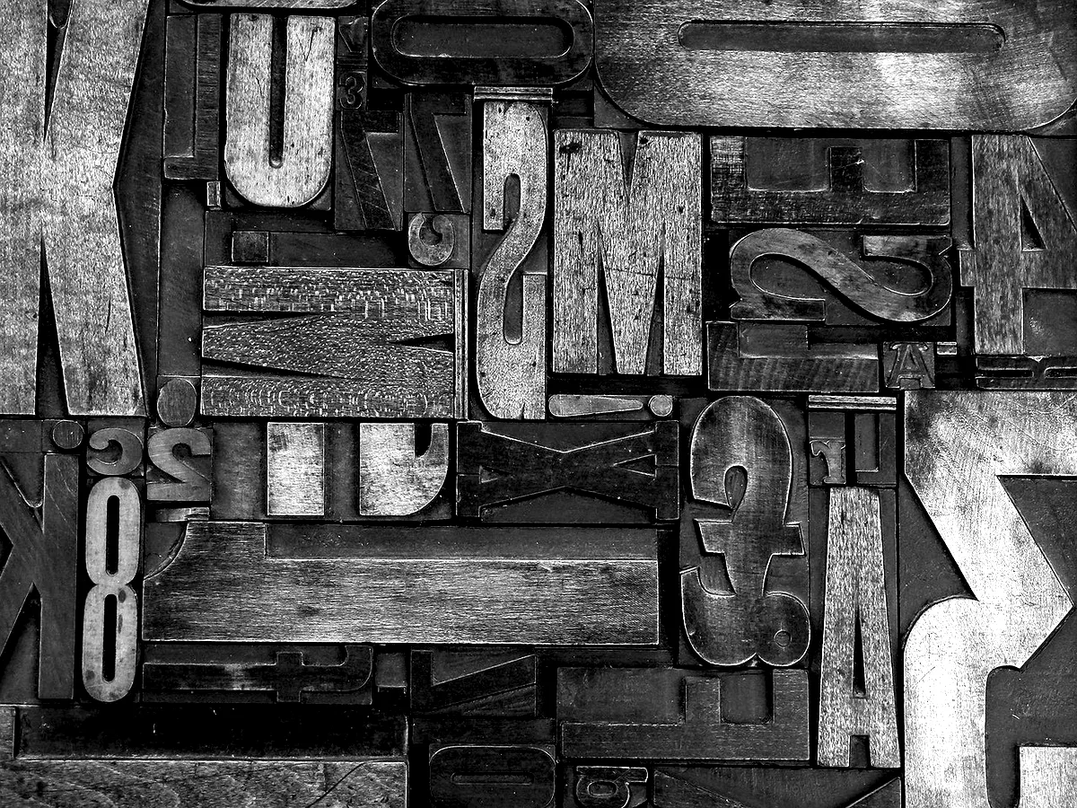 A hand-drawn alphabet, capitals and lowercase, ruled out on paper.