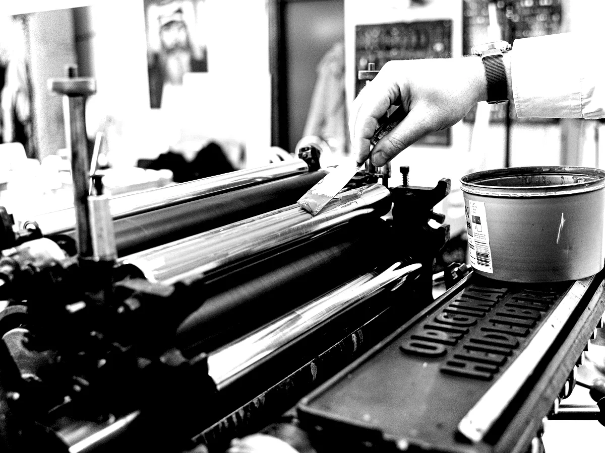 Ink rollers on a proofing press charged with a single ink.