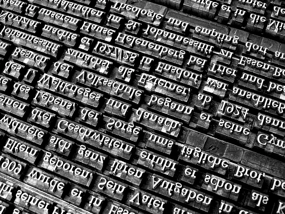 A type case of metal sorts in their compartments.
